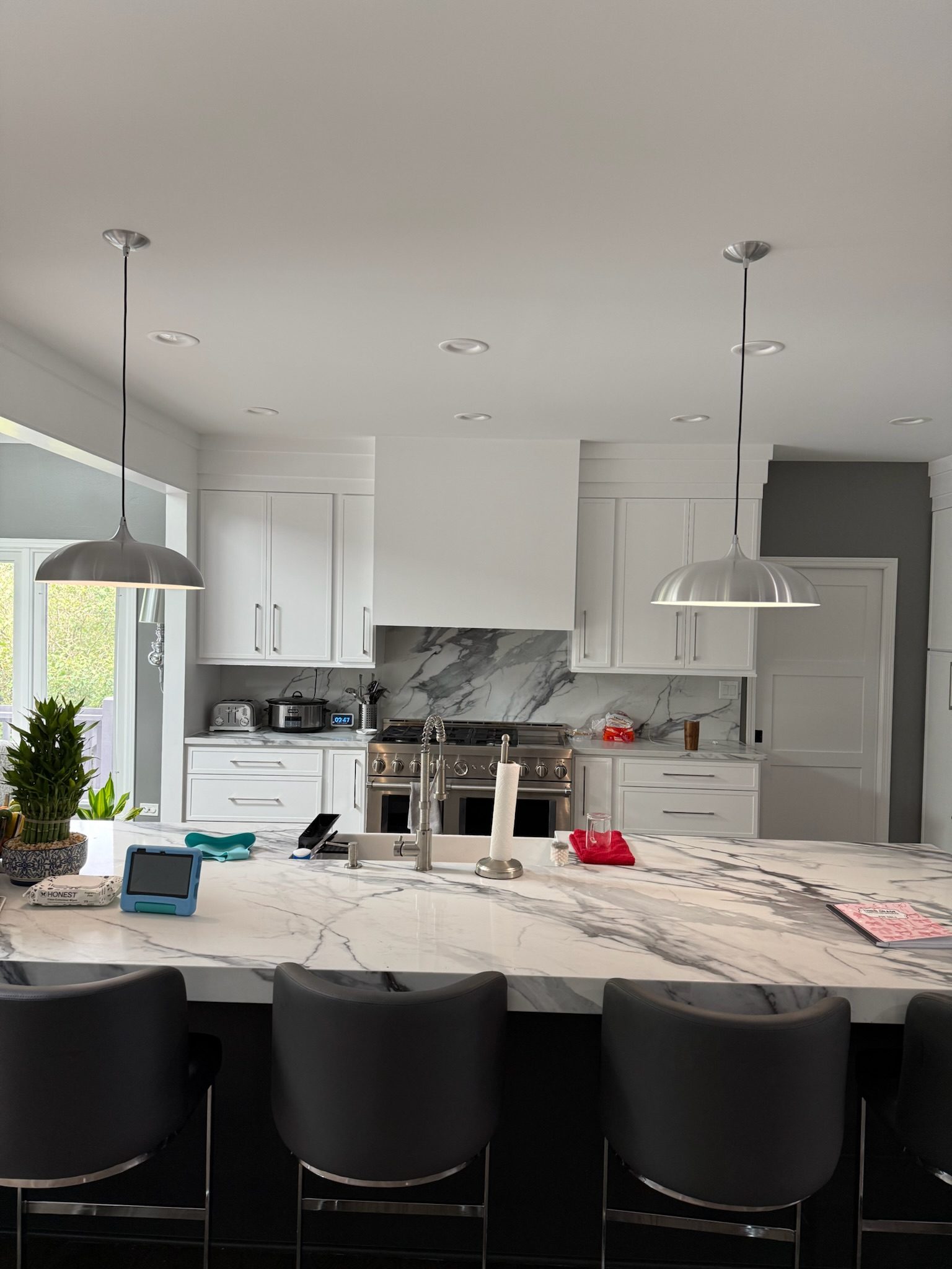 Painted island and full-height quartz backsplash